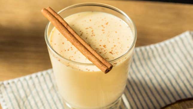 Eggnog cocktail with cinnamon stick