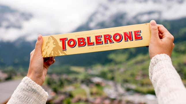 hands holding toblerone bar