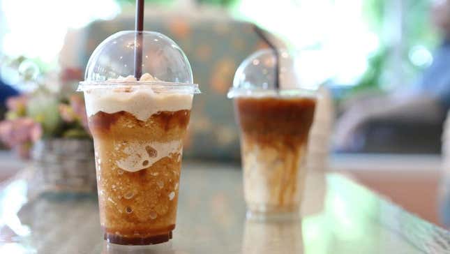 Coffee drinks on counter at coffee shop