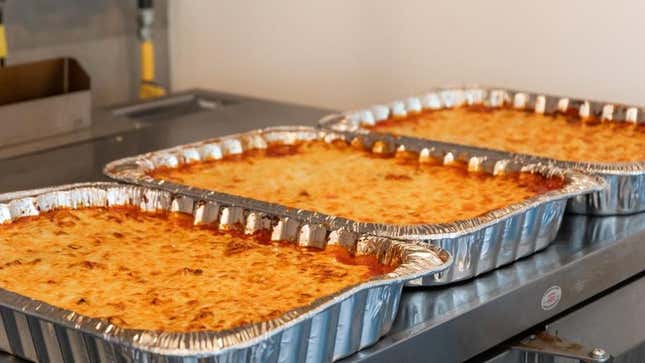 Three large casseroles in aluminum trays