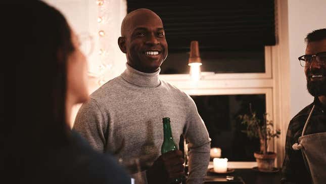 Host and party guests laughing
