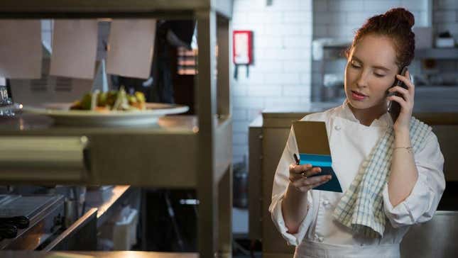 Chef taking order in restaurant via phone